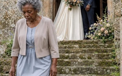 When I arrived at my son’s wedding, he blocked my path at the church door and said: “I didn’t invite you, Mom. The whole family decided you’re no longer a part of us.” I looked at him, gripped my purse, and replied in a low voice: “That’s fine, son… but don’t forget to check your phone.” What no one knew was that, that afternoon, the truth was already on its way.